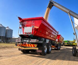 side tipper trailer filling with grain