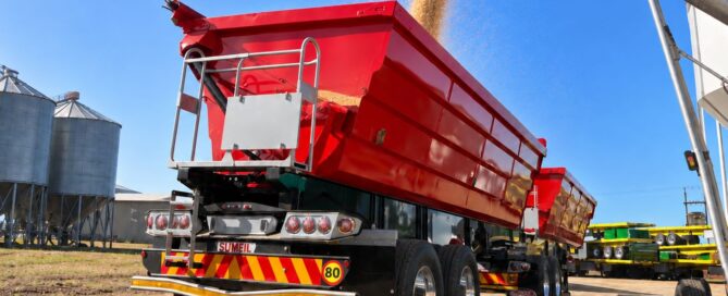 side tipper trailer filling with grain